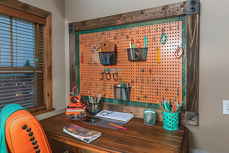 A desk with a wall mounted pegboard organizer