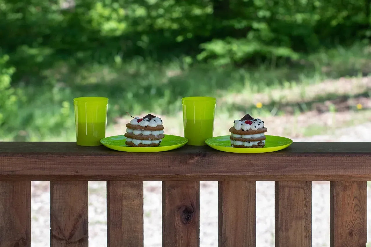 Green glasses and cupcakes on the outdoor kitchen stand