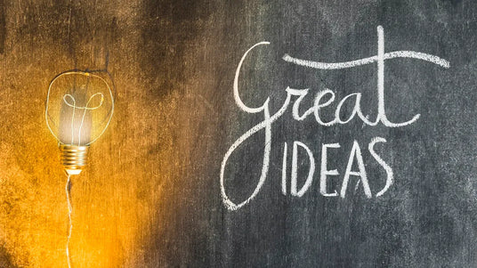 Great Ideas sign and a lamp on the coloured plywood board